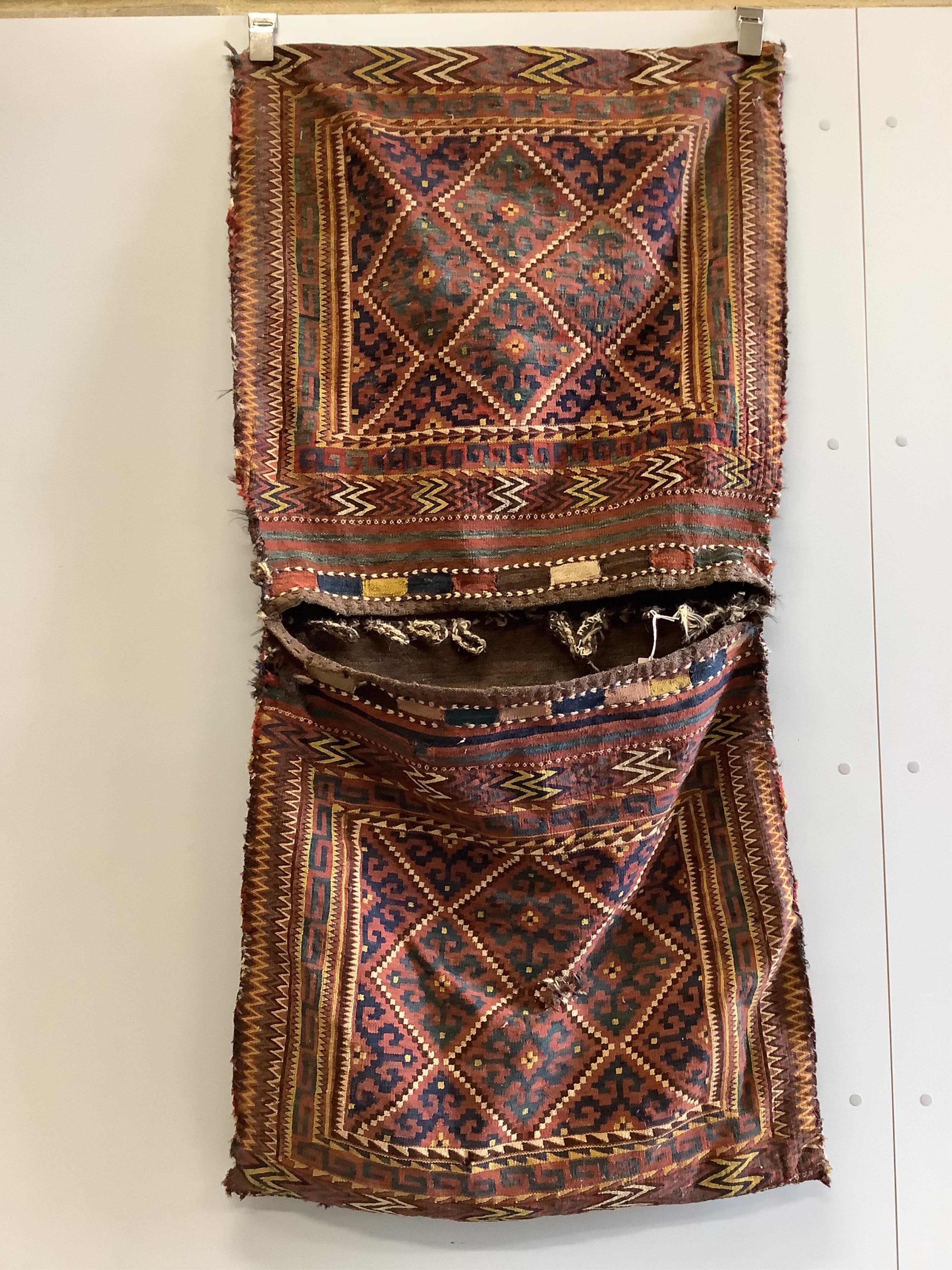 An Afghan Kilim saddlebag, 150 x 76cm. Condition - fair